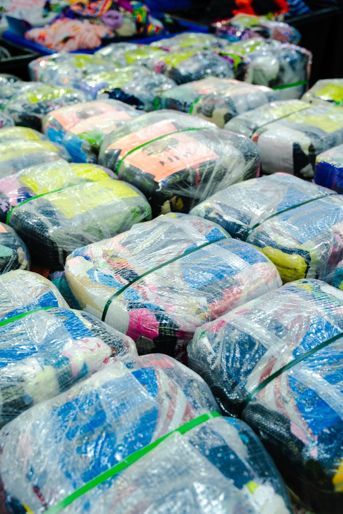 Rows of graded and wrapped clothing bales
