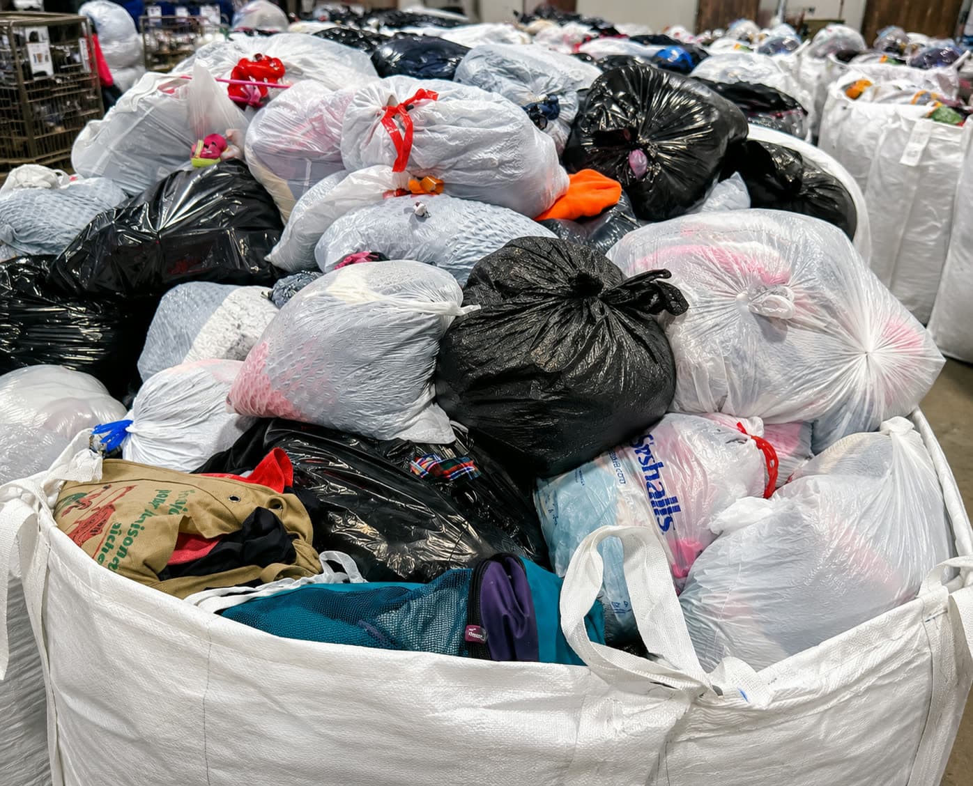 Bagged original credential clothing collected in a bulk bag