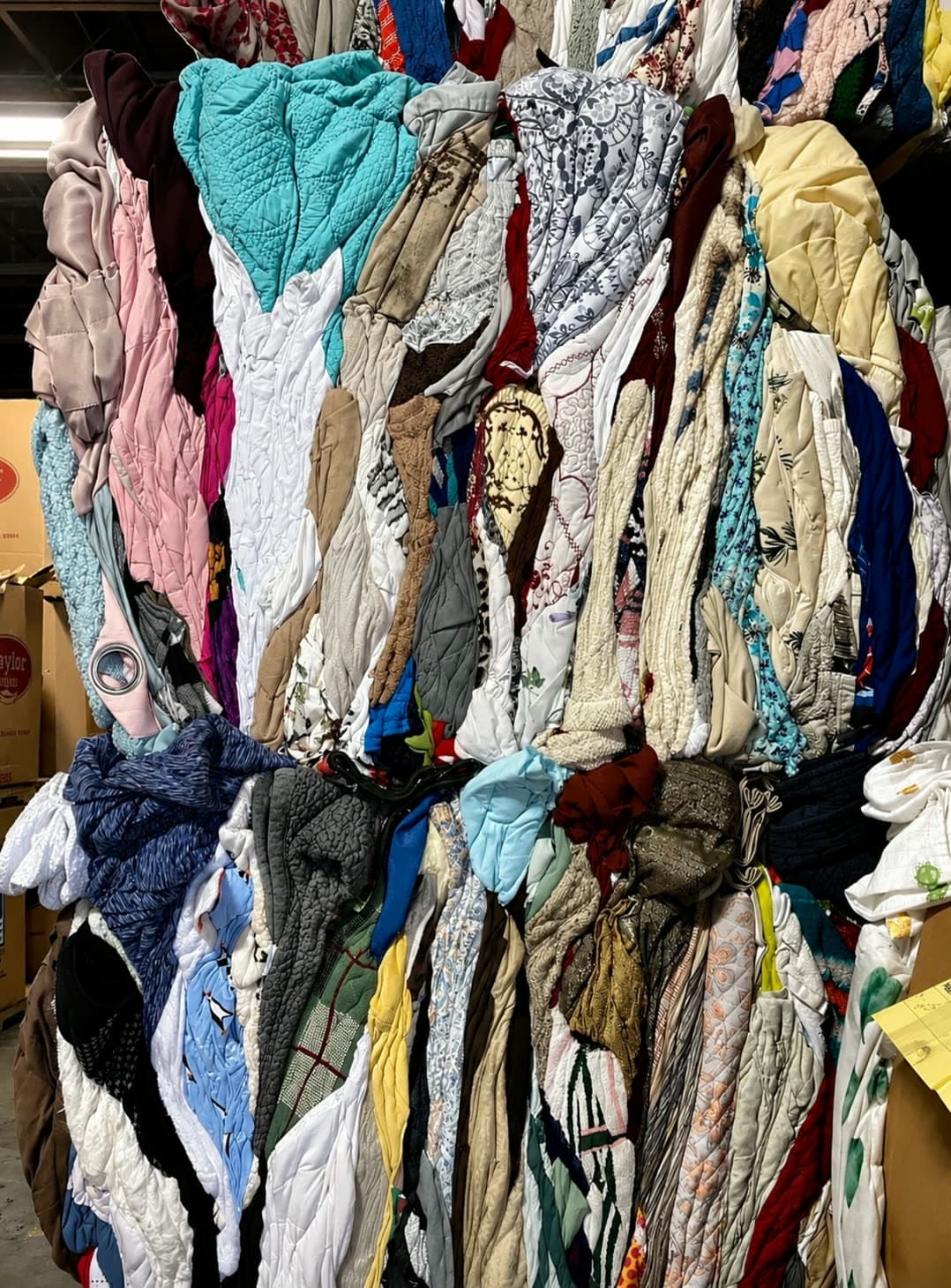 Compressed bale face of quilts, blankets, and household linens